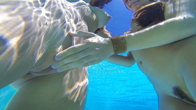 Nude girls making love in the pool