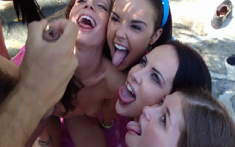 Daring teen girls gather around the pool and suck one cock