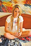 Cutie plays with her young pussy in her bedroom